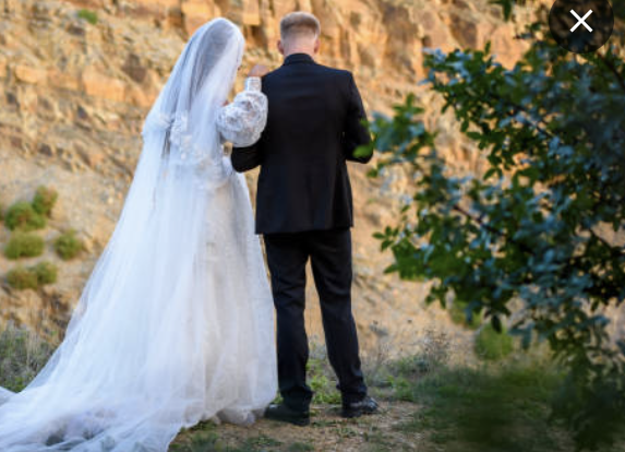 one couple standing next each other at the wedding