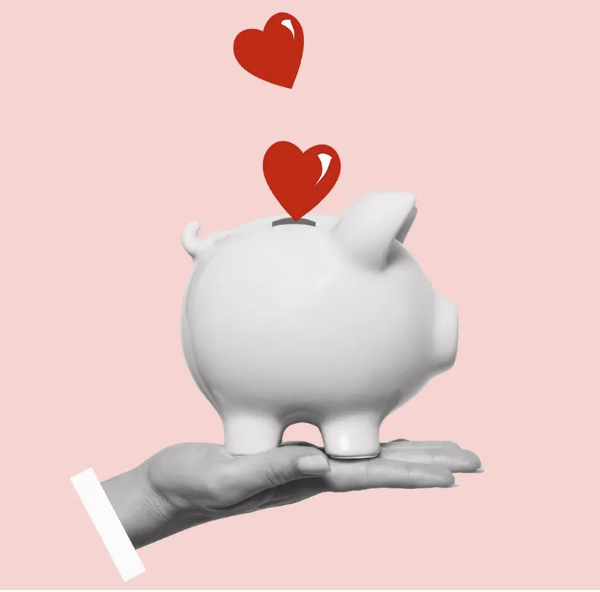 Piggy bank colecting herts on the hand