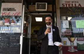 NYC Mayer standing in front of restaurant