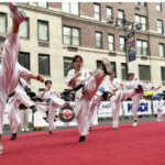 Performers on the red carpet in the rain