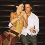 one couple is smiling togather, flierting
